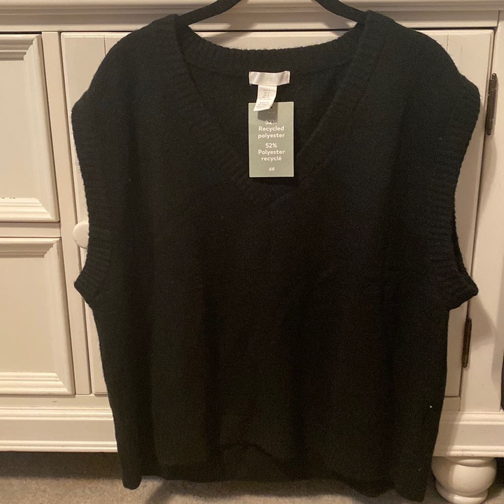 Woman’s black vest sweater